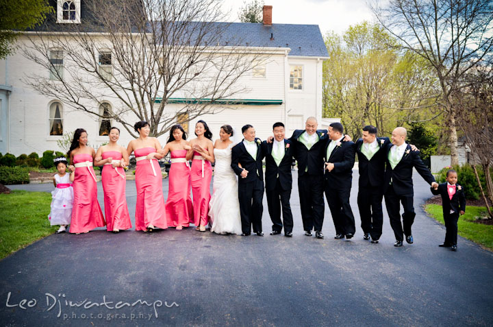 Flower girl, ring bearer boy, bridesmaids, maid of honor, bride, groom, best man and groomsmen walking together. Ceresville Mansion Frederick Maryland Wedding Photo by wedding photographer Leo Dj Photography